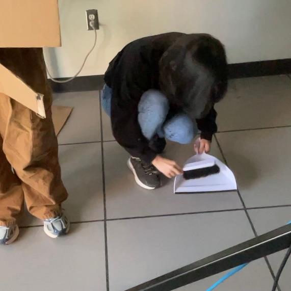 This is the smart cleaning robot that can detect whether the environment is clean or not, it will clean the kitchen with the wet spill. The robot can identify the mess automatically and respond without user controlling it, also demonstrates how the smart kitchen supports the user during cooking.